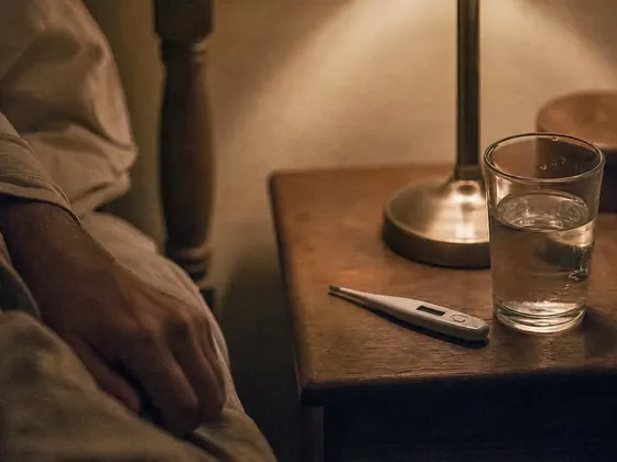 thermometer on a bedside table, night