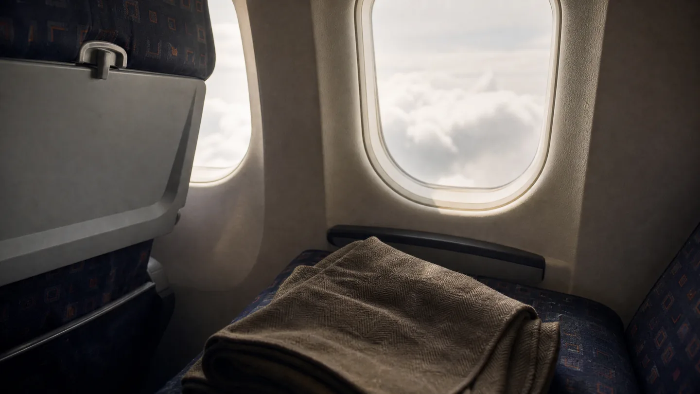 aircraft window, blanket, daylight
