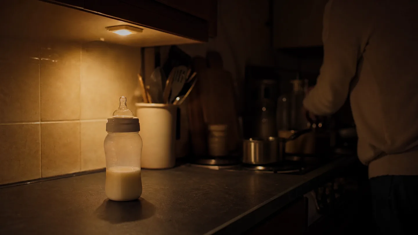 measured bottle on a worktop, night kitchen