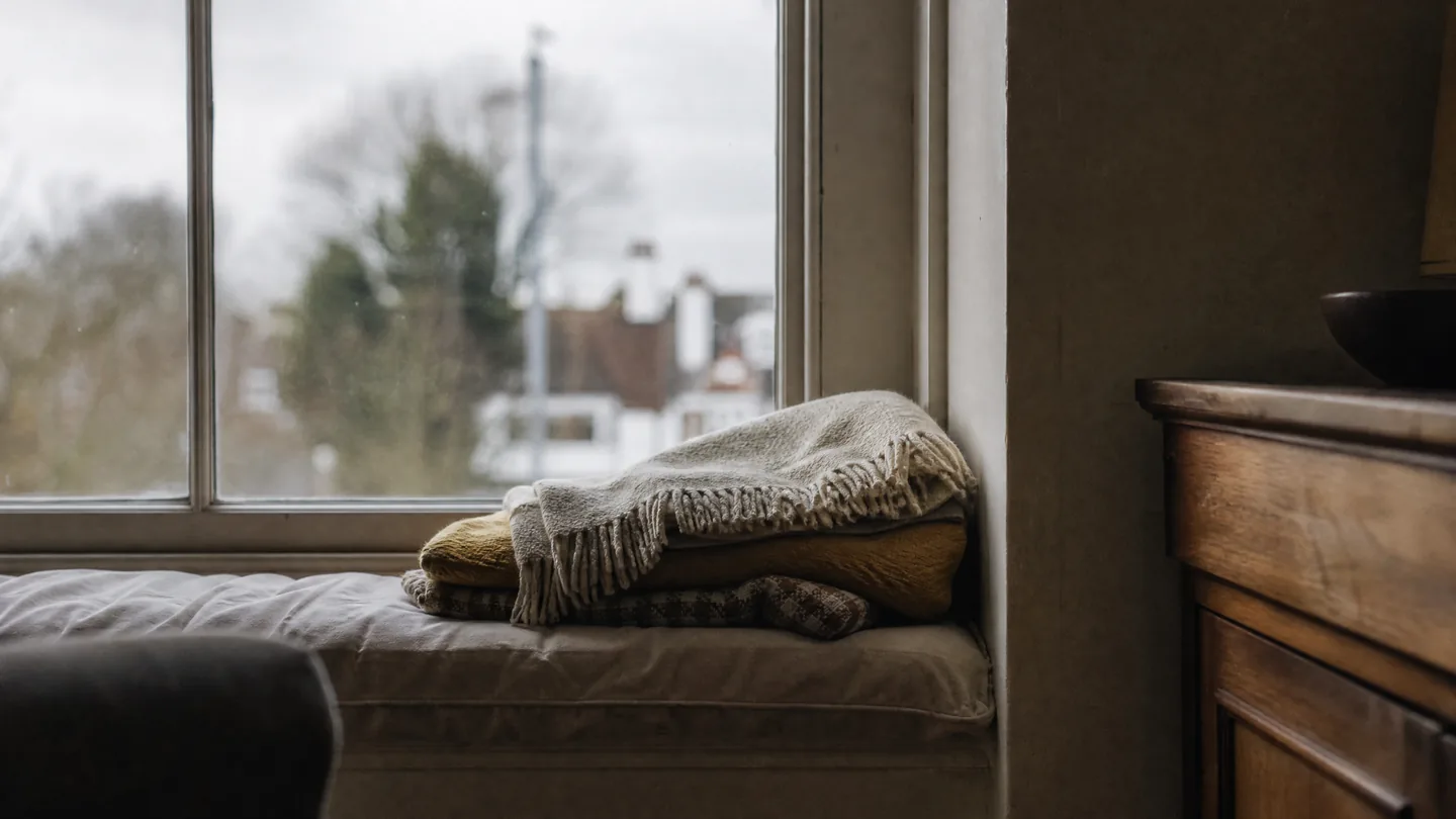 window seat, grey morning, blanket